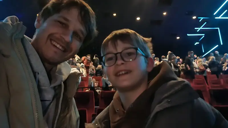 A child and an adult enjoying a concert together